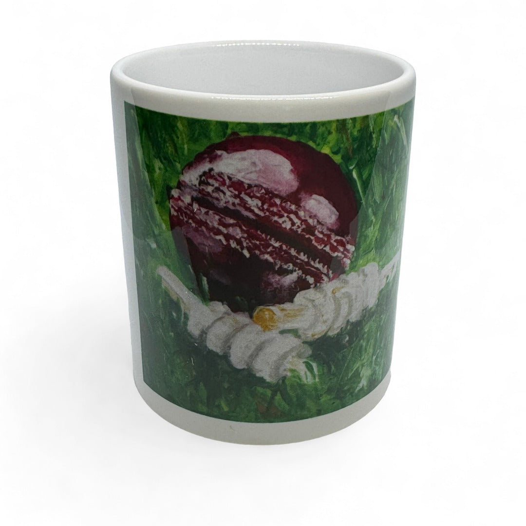 CRICKET-GIFTS - Cricketer's Mug | Ceramic Design by Anthony Kelly | Cricket Ball & Bails Artwork | 300ml Capacity | Ideal for Cricket Enthusiasts | Cricket Ball Design, White, Green